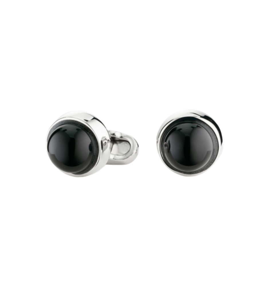 Pair of black cufflinks on a white background
